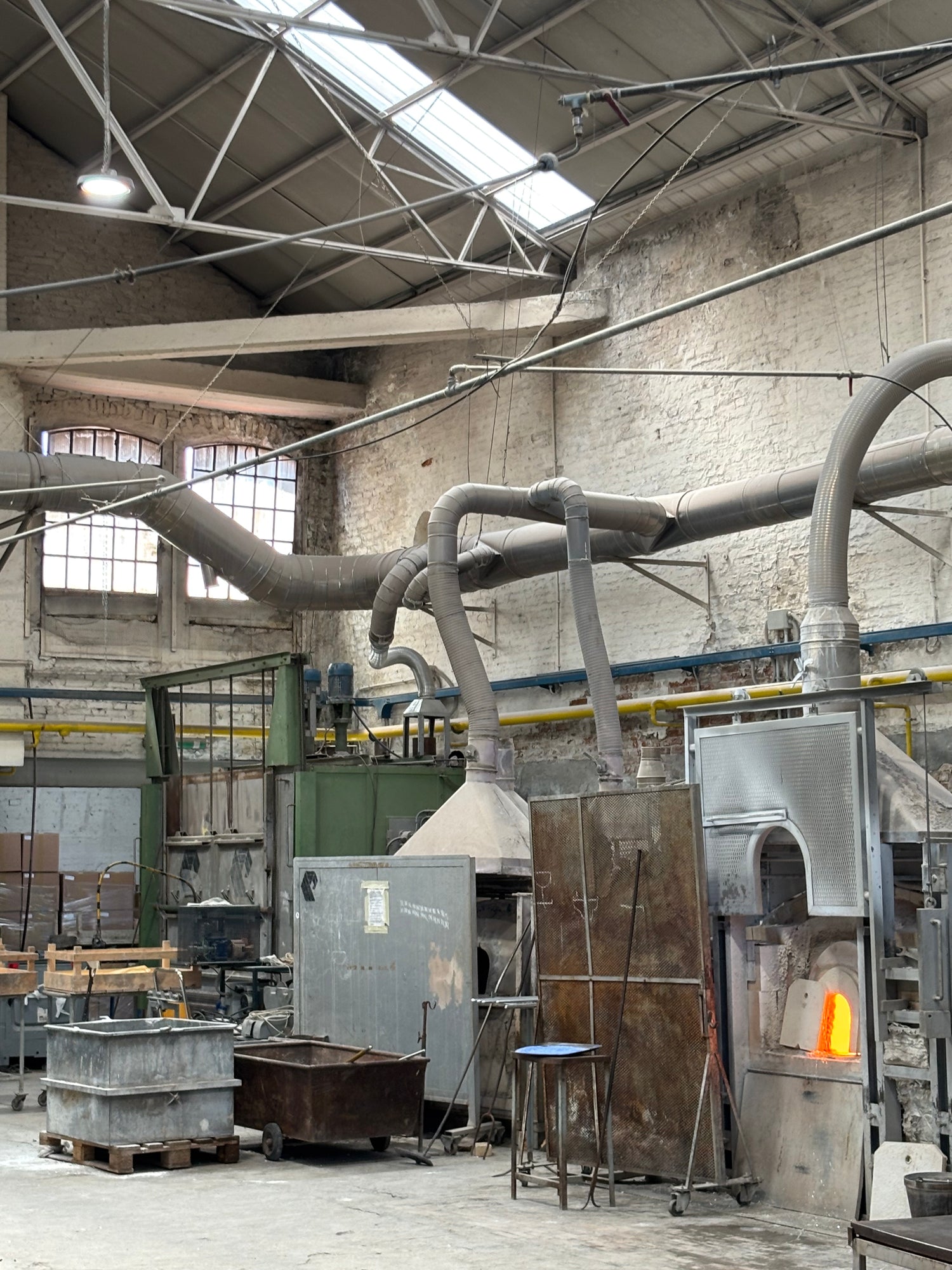 Murano glassmaking studio with traditional furnace used to hand-blow Tavolini glass objects.